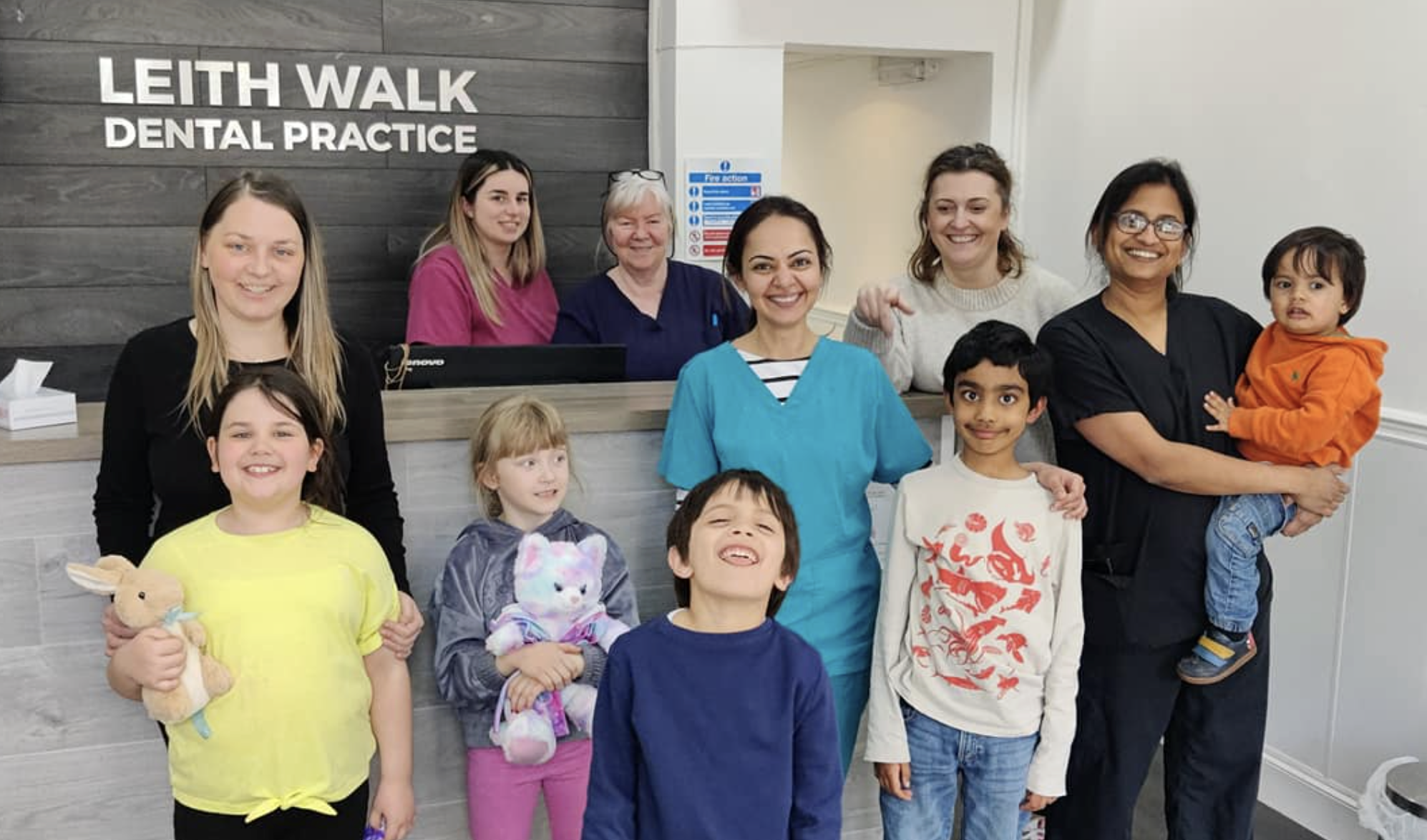 Leith Walk Dental Practice team with patients at reception